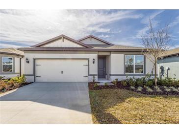 New single-story home with attached garage and landscaped lawn at 4416 Sw 84Th Street Rd, Ocala, FL 34476