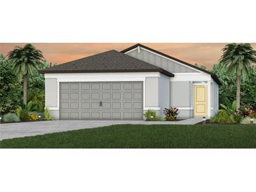 One-story home with gray siding, two-car garage, and landscaping at 8319 Sw 54Th Loop, Ocala, FL 34481