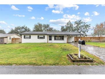 Newly renovated home with a modern exterior and spacious yard at 832 Princeton St, Lakeland, FL 33809