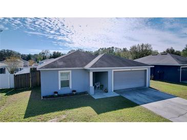 Cute 2-bedroom, 2-bath home with a 1-car garage and fenced backyard at 1621 Saddlehorn Dr, Lakeland, FL 33810