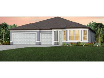 Two-story home with gray exterior, three-car garage, and landscaping at 4471 Sw 84Th Street Rd, Ocala, FL 34476