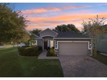 Attractive one-story home with a two-car garage and well-manicured lawn at 16317 Saint Augustine St, Clermont, FL 34714