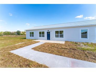 Front view of a newly built home at 6085 Lightsey Rd, Fort Meade, FL 33841