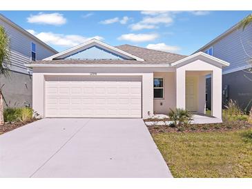 Single-story home with attached garage and landscaped yard at 4079 Gardenia Ave, Lake Hamilton, FL 33851