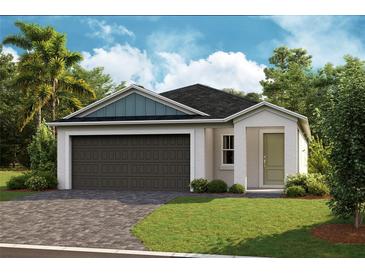 One story home with two car garage, landscaping, and driveway at 6230 Sw 96Th Pl, Ocala, FL 34476