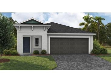 One-story home with a two-car garage and landscaping at 6244 Sw 96Th Pl, Ocala, FL 34476