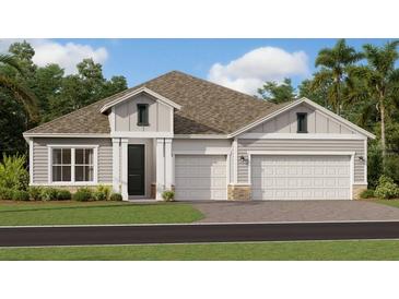 Two-story home with three-car garage and landscaped lawn at 1955 Rider Rain Ln, Apopka, FL 32703