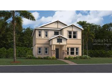 Two-story Craftsman style home with stone accents and landscaping at 3112 Springbank Dr, St Cloud, FL 34771