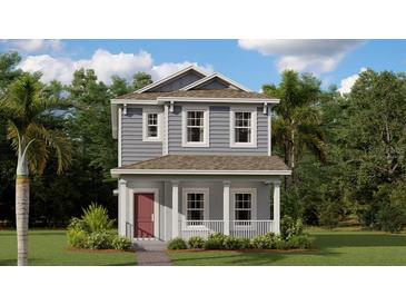 Two-story house with gray siding, red door, and a landscaped lawn at 5758 Meditation Dr, Clermont, FL 34714