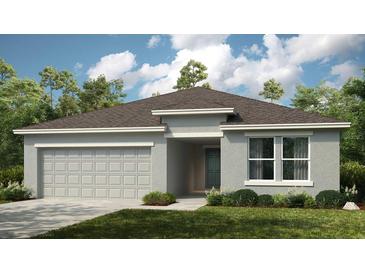 One-story home with a two-car garage and landscaped front yard at 1951 Rosewood Cir, Lakeland, FL 33810