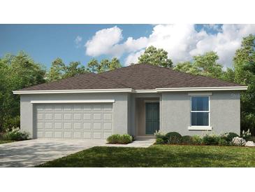 One-story home with gray siding and two-car garage at 1924 Rosewood Cir, Lakeland, FL 33810