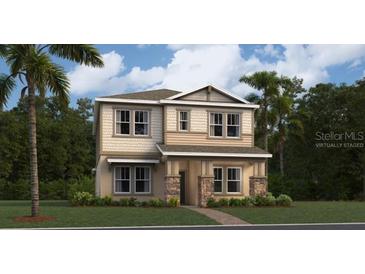 Two-story home with stone accents and landscaping at 3141 Zuni Rd, St Cloud, FL 34771