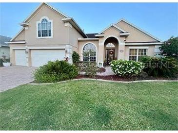 Charming single-Gathering home featuring well-manicured landscaping and inviting curb appeal at 113 Walton Heath Dr, Orlando, FL 32828