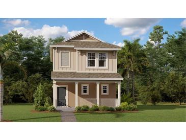 Two-story craftsman style home with light beige exterior, gray door, and small front porch at 4154 Jespersen St, Apopka, FL 32712