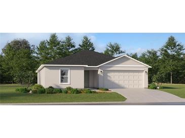 One-story house with gray siding, neutral garage door, and landscaping at 4192 Singing Mockingbird Blvd, Bartow, FL 33830