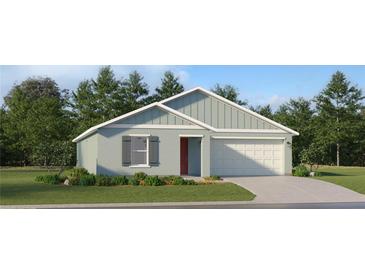 Single story home with a light blue exterior and a two-car garage at 4212 Singing Mockingbird Blvd, Bartow, FL 33830