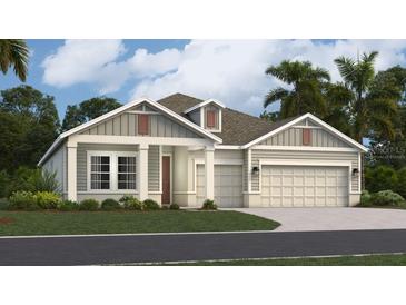 One-story home with gray siding, brown accents, and a two-car garage at 290 Puma Loop, Groveland, FL 34736