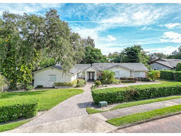 Beautiful home with a large front yard, paved driveway and lush landscaping at 1400 S Pennsylvania Ave, Winter Park, FL 32789