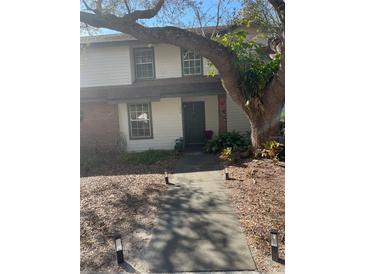 Inviting exterior of the house with a well-maintained walkway at 190 Post Way, Casselberry, FL 32707