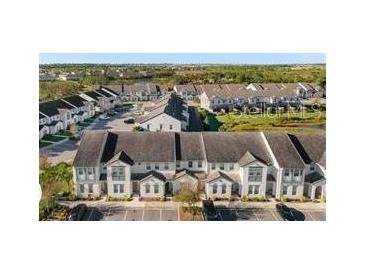 Aerial view of townhouses with parking at 305 Captiva Dr, Davenport, FL 33896