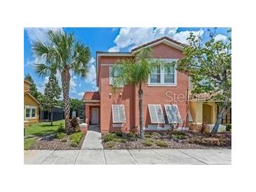 Attractive two-story townhome with a charming front porch at 4753 Vero Beach Pl, Kissimmee, FL 34746