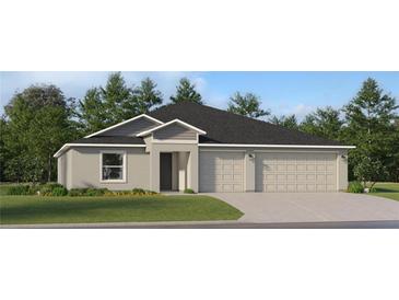 Two-story house with a three-car garage and landscaped lawn at 2081 Lasso Loop, Eagle Lake, FL 33839