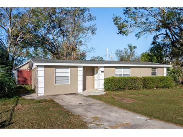 Cozy single-story home featuring a well-maintained lawn and a private driveway, blending comfort with simple suburban living at 6317 Georgia Ave, Lakeland, FL 33813