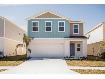 Charming two-story home with a two car garage and beautifully landscaped yard at 1901 Harrods Pl, Haines City, FL 33844