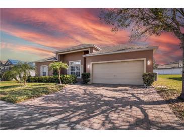 Charming single Gathering home with two car garage and mature landscaping at 3890 Wood Thrush Dr, Kissimmee, FL 34744