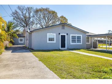 Charming single-story home featuring a well-maintained lawn and convenient driveway at 725 Strain Blvd, Lakeland, FL 33815