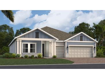 Charming one-story home featuring a three-car garage, blue siding, and a well-manicured lawn at 1919 Rider Rain Ln, Apopka, FL 32703