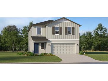 Two-story home featuring a lawn, neutral siding, a driveway leading to an attached two-car garage, and a blue front door at 1305 Acorn Meadow Loop, Eustis, FL 32726