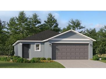 Charming single-story home with a two-car garage and well-maintained landscaping at 1325 Acorn Meadow Loop, Eustis, FL 32726