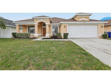 Charming single Gathering home featuring a well-maintained lawn and inviting curb appeal at 2726 Herons Landing Dr, Kissimmee, FL 34741