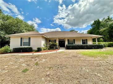 Charming single story home with well-maintained landscaping and a welcoming front porch at 5261 Waterwood Dr, Bartow, FL 33830