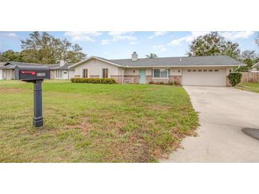 Charming single-story home with mailbox, manicured lawn, and two-car garage at 5105 Se 25Th St, Ocala, FL 34480