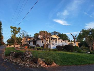 Charming home with a beautiful landscaped front yard and lovely curb appeal at 2404 Waycross Ave, Eustis, FL 32726