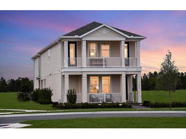 Charming two-story home with double porch, landscaped yard and neutral paint at 16198 Honey Harvest St, Winter Garden, FL 34787