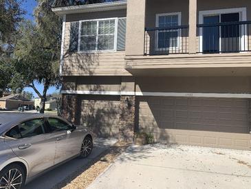 Two-story home with two car garage and stone accents at 1555 Scarlet Oak Loop # 113A, Winter Garden, FL 34787