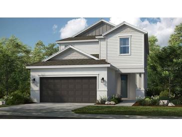 Charming two-story home featuring a two-car garage and professionally landscaped front yard at 5190 Goldfinch Dr, St Cloud, FL 34771