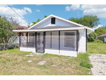 Charming single-story home with a screened porch and a well-maintained, small front yard at 515 9Th St, Winter Garden, FL 34787
