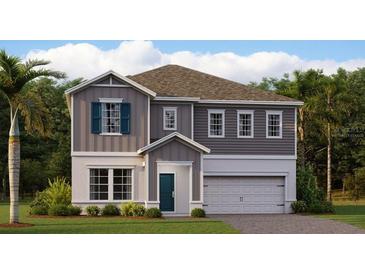 Charming two-story home with well-manicured landscaping and a two-car garage at 759 Terrapin Dr, Debary, FL 32713