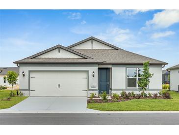 Charming single-Gathering home with a two-car garage, manicured lawn, and well-maintained landscaping at 5333 Sw 81St Cir, Ocala, FL 34481