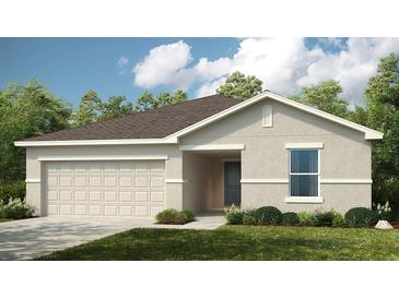 Charming single-story home with a two-car garage and well-manicured lawn at 1931 Rosewood Cir, Lakeland, FL 33810