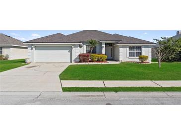 Charming single-story home featuring a well-manicured lawn and inviting curb appeal at 524 Buckshot Ln, Lakeland, FL 33809