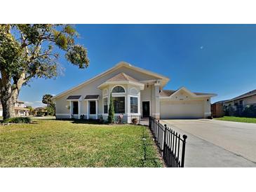 Charming single-story home with well-manicured lawn and inviting curb appeal at 512 Lost Creek Ct, Kissimmee, FL 34743