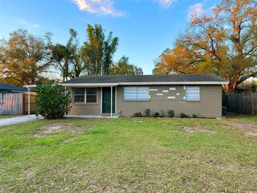 Charming single-story home featuring a well-maintained lawn and a classic facade at 231 4Th St, Winter Haven, FL 33880