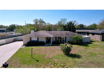 Charming one-story home with a well-maintained lawn, mature landscaping, and inviting curb appeal at 1743 Wilshire Ct, Lakeland, FL 33813