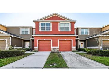 Charming multi-Gathering home featuring two-story design, private driveways, and welcoming curb appeal at 2938 Rodrick Cir, Orlando, FL 32824