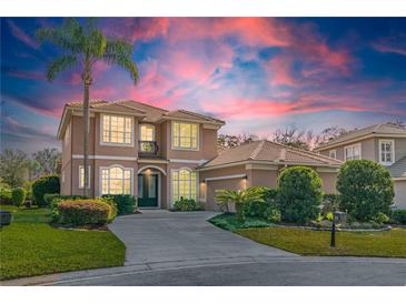 Beautiful two-story home with a well-manicured lawn, lush landscaping, and a grand entryway at 1229 Sebastian Cv, Lake Mary, FL 32746